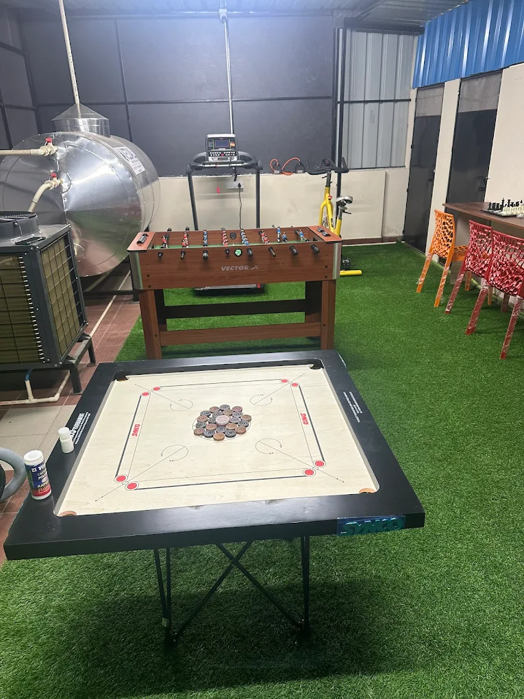 Rooftop recreation area with carrom and foosball