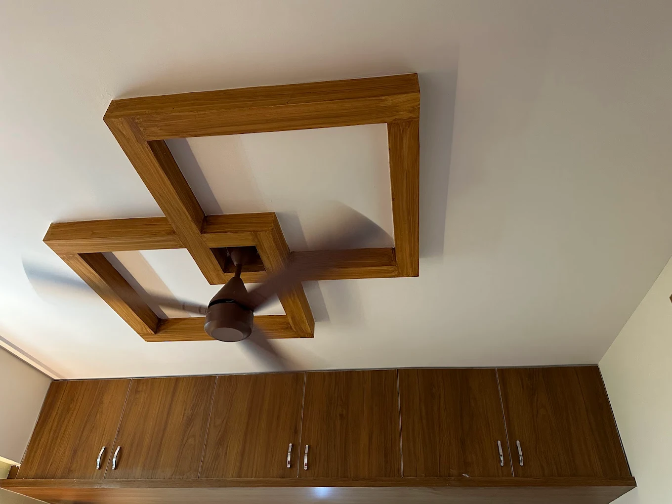 Designer false ceiling and wooden wardrobe